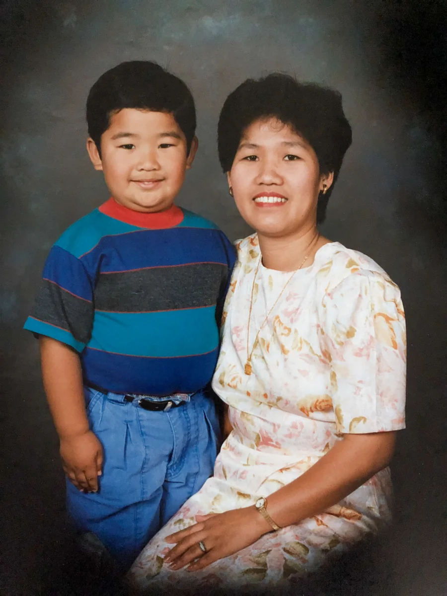 Mike as a boy with his mom, a studio portrait.