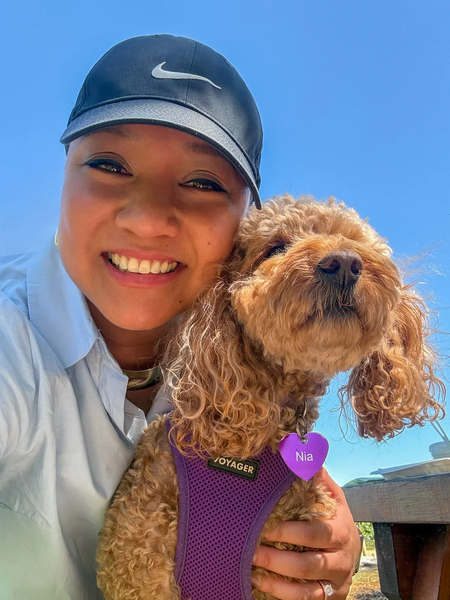 Rachel and Nia cheek to cheek in a selfie under a blue sky.